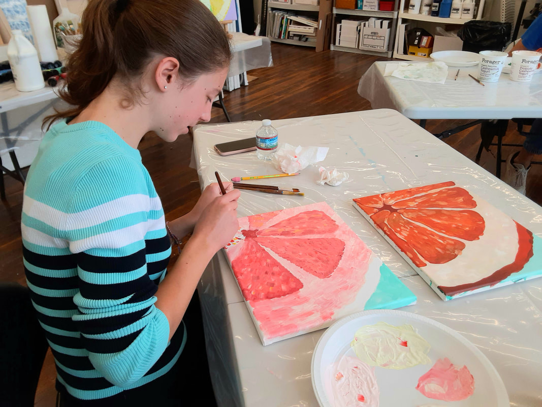 Student painting in an art class at Catherine Carter Art School, Hatch Street Studios, New Bedford.